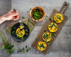 Enjoying a few sun dried tomato and spinach egg frittatas with parsley