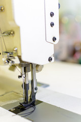professional production sewing machine close-up, leather production, seamstress, tailor
