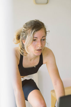 Female Cyclist During A Spin Class Workout