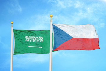 Saudi Arabia and Czech Republic two flags on flagpoles and blue cloudy sky