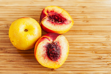 Freshly cut peaches on a cutting board