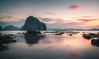 Philippine sunset in a sea landscape with pink colors in the sky © Juan