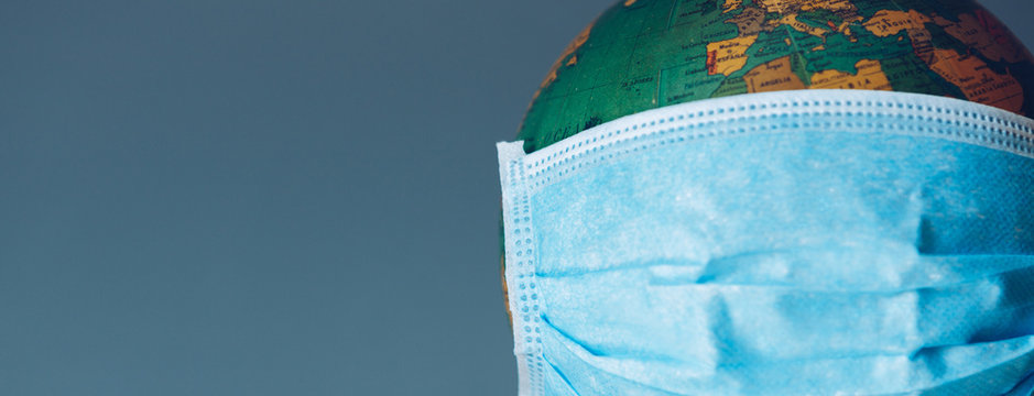 Earth globe with face mask protection. Universal coronavirus medical concept