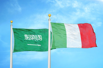 Saudi Arabia and Italy two flags on flagpoles and blue cloudy sky