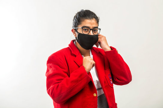 A Teenage Indian Girl In School Uniform Wearing Face Mask During Corona Virus Pandemic In India