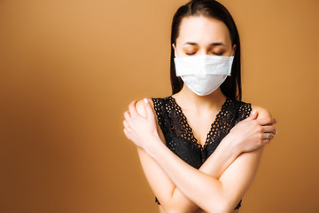 Portrait of a brunette in a medical mask. Coronavirus. Means of protection against the virus....
