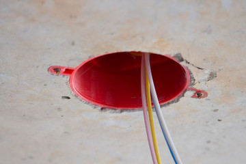 close-up of a three-phase electrical cable in a junction box.