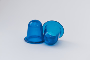 Body care, against cellulite. Home methods and means for beauty. Cupping massage on a white isolated background