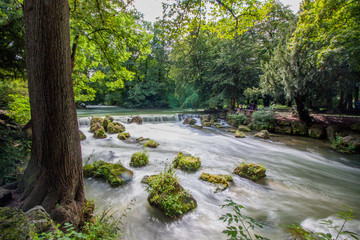flowing water small river in park munich english garden
