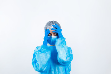 a doctor in a medical protective suit is upset and sorry