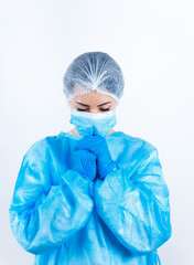 a doctor in a medical protective suit is upset and sorry