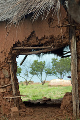 view through the door of a ruined adobe hut