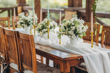 Decorated wedding table for the newlyweds and guests with mountain views. Wedding decor and Floristics.