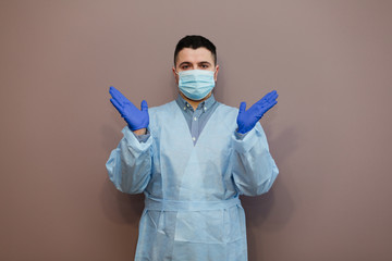 male doctor wearing mask and protective gloves.Covid-19