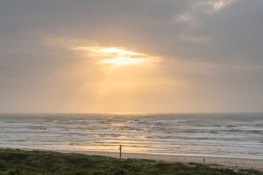 Aerial View Of Texas Beach Without Any People With Sun Through The Clouds