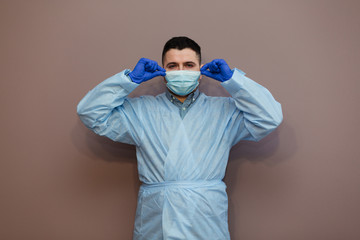 Covid-19 virus doctor wearing surgical mask to protect against Coronavirus virus and pandemic