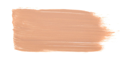 Close up of smeared cream nude color. Face skin concealer, make up base creamy texture on white isolated background with free copy space for text.