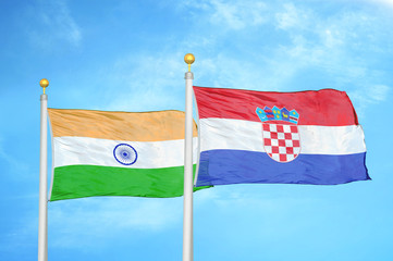 India and Croatia two flags on flagpoles and blue cloudy sky