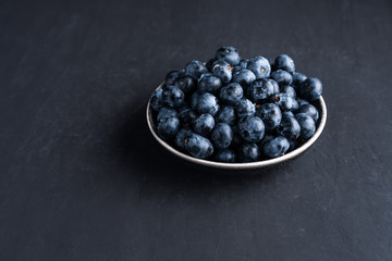 Blueberry antioxidant organic superfood in ceramic bowl concept for healthy eating and nutrition