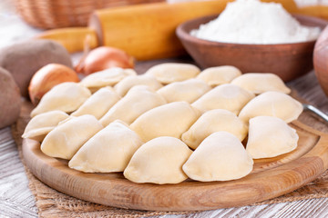 Fototapeta na wymiar Raw dumpling with potatoes. Preparation dumplings