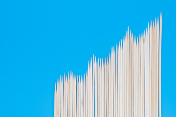 Thin pointed sticks on a blue background