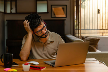 Bored man during quarantine time. Home office concept.