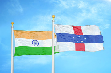 India and Netherlands Antilles two flags on flagpoles and blue cloudy sky