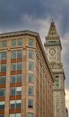 Fototapeta na wymiar An old office building and a classic clock tower in Boston, Massachussetts