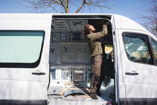 Man Beginning Work On His Self Made Camper Van