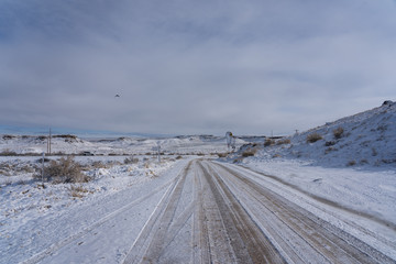 Rural road covered in snow in Utah in winter
