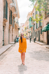 Fototapeta na wymiar Tourist girl in popular area in Havana, Cuba.