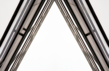 Obraz premium corner of the wall and windows of a modern tall office building without people