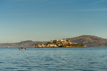 Fototapeta na wymiar View of Large Sail Boat and Alcatraz Prison in San Francisco