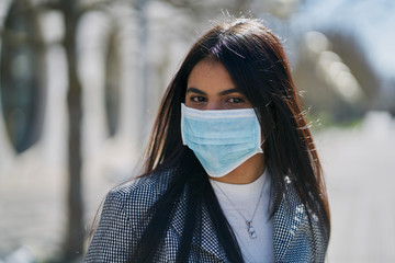 Girl with a protective mask to avoid contagion. Coronavirus concept