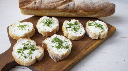 Sandwiches on a wooden board. On a white background. Copyspace