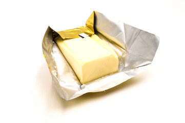 Block of rectangular fresh butter with packaging