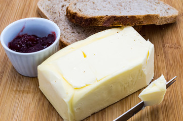Block of fresh rectangular butter with jam