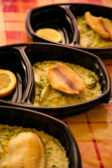 dietary fish with broccoli ,in a disposable container,for delivery of food at home