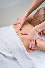 Obraz na płótnie Canvas Professional practitioner doing massage for healthy back