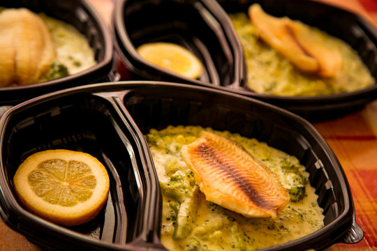 dietary fish with broccoli ,in a disposable container,for delivery of food at home