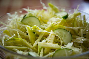 fresh cabbage salad with cucumbers,in a disposable container,for delivery of food at home
