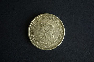 Obverse side of 20 Danish Kroner coin on black background. Currency and Economy of Denmark. High Resolution Photography.