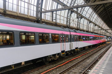 Fototapeta premium Train at a platform in Amsterdam Centraal Station