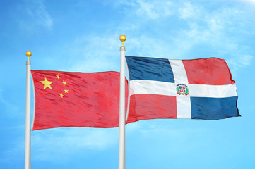 China and Dominican Republic two flags on flagpoles and blue cloudy sky