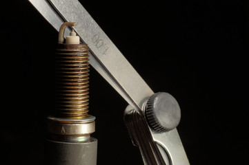Spark plug and feeler gauge. Internal combustion engine service.