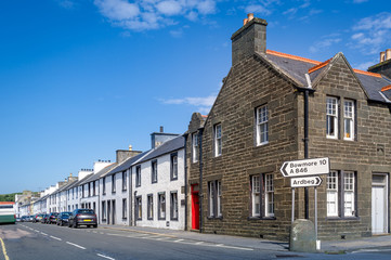 Port Ellen and Bowmore road sign. Way to famous distillery of Islay. Hebrides cruise, Scotland
