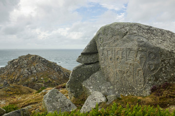 Monks Stone with Buddhist Carving on the Island of Sark (Mantra translating to: Behold the jewel in...