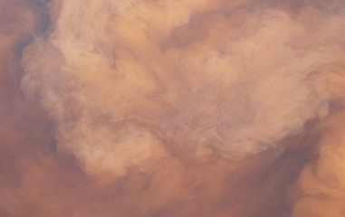 Mud and water merge together, creating the theme of a toxic liquid in which swirls of dirt move,...