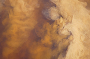 Mud and water merge together, creating the theme of a toxic liquid in which swirls of dirt move,...