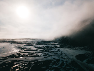 Dyrfjoll mountain covered in fog and mist, Iceland.